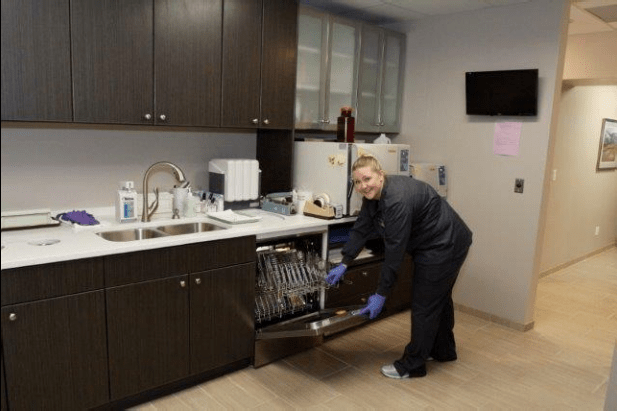 Dental Tech Desfifecting Dental Utelsils - Dr. Seibert's Office