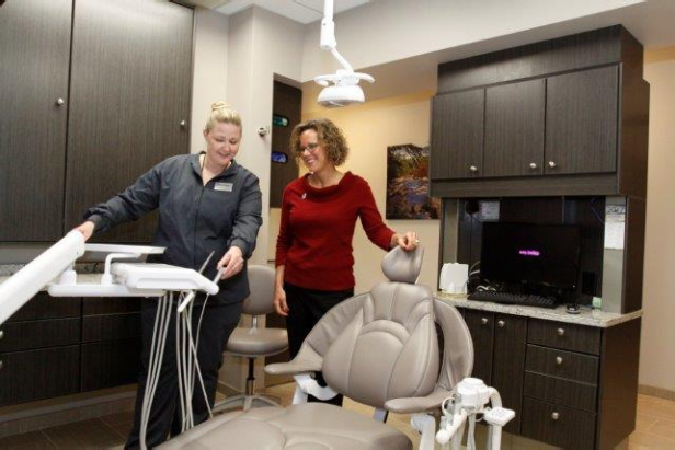 Staff Member Walking a Patient into Treatment Room - Dr. Seibert