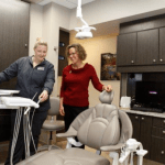 Staff Member Walking a Patient into Treatment Room - Dr. Seibert